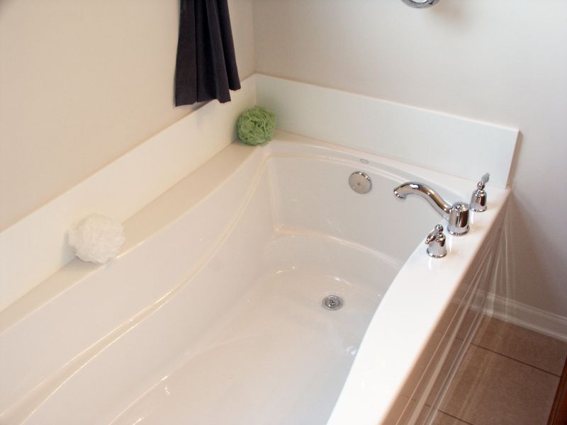 Happy Homeowner with Refinished Bathtub